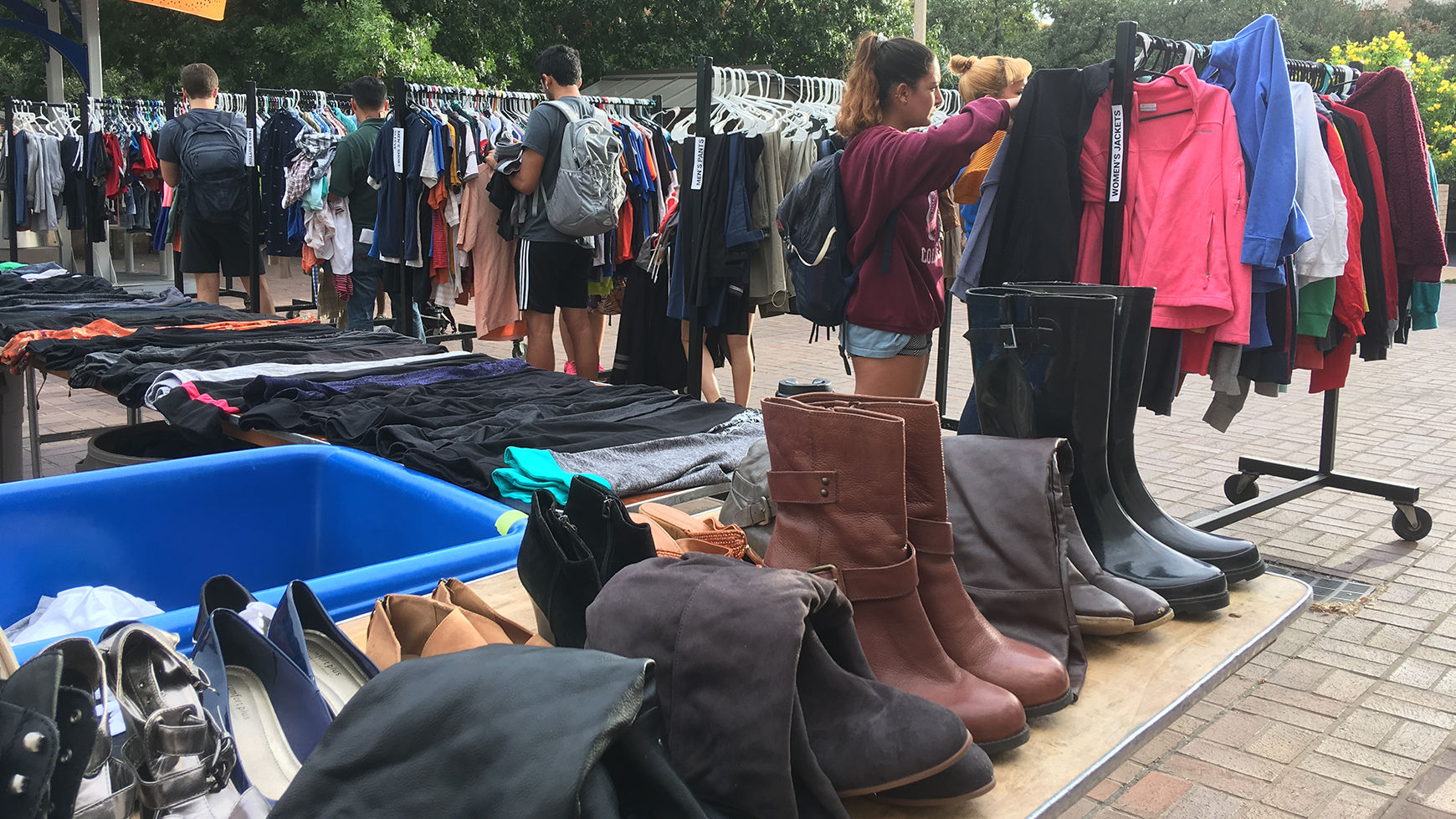 Students browse clothes at pop-up thrift sale
