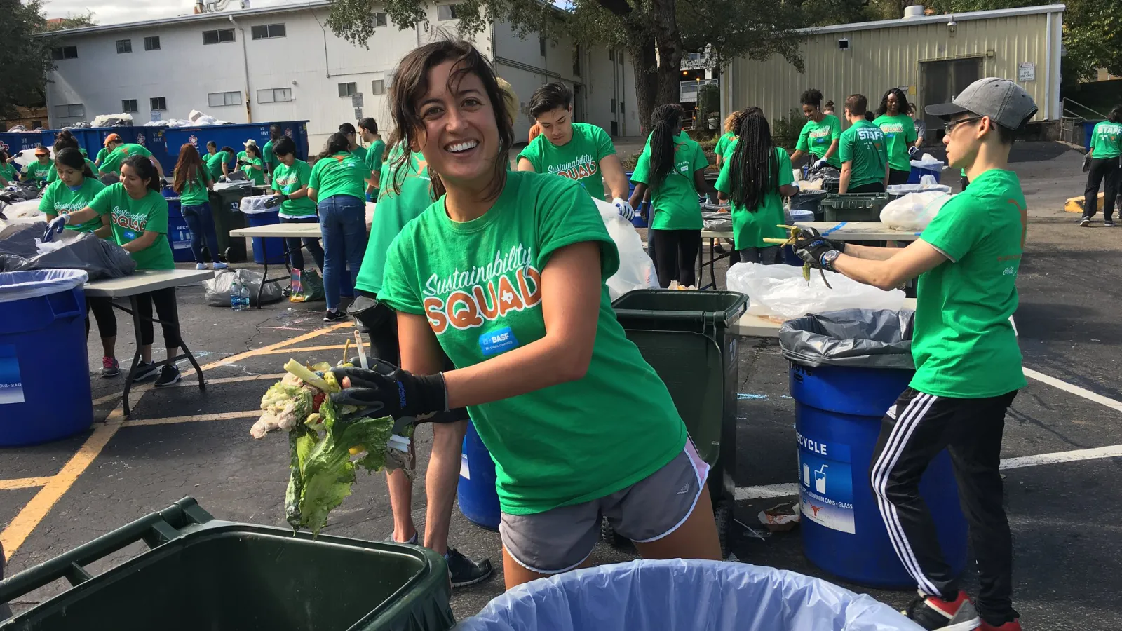 Student volunteers to sort waste after a UT football game