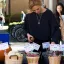 Student sets out produce for sale at UT Farm Stand